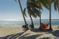 Playa giron, Cuba Ã¢â¬â January 2, 2017: Travelers relaxing on hammocks with bikes on tropical beach in Cuba, travel concept